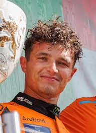 Lando on the podium, smiling